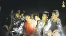  ??  ?? A video grab handout made available by the Thai navy SEALs shows some of the members of a soccer team in a section of Tham Luang cave in Khun Nam Nang Non Forest Park on Wednesday in Chiang Rai, Thailand.