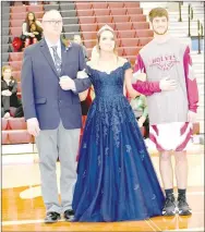  ??  ?? Senior maid Abby Goldman, daughter of Kelly and Ryan Goldman, escorted by her father and senior Clark Griscom, son of Curtis and Becky Griscom.