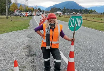  ?? DEBBIE JAMESON/STUFF ?? Former Queenstown tourism worker Fiona McArthur is thankful for her job in traffic control.