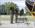  ?? ?? Placing a wreath were Garrison Commander Lt. Col. Trent Colestock and Command Sgt. Maj. Jamie Rogers.