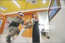  ?? PROVIDED TO CHINA DAILY ?? Left: A student tries a virtual reality spinning session that helps relieve users of negative emotions at a mental health center in Jiaxing, Zhejiang, in May.