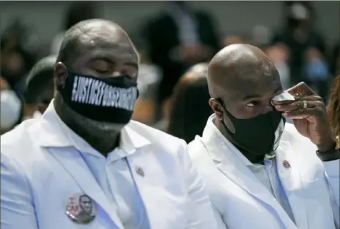  ?? Getty Images ?? Philonise Floyd, right, and Rodney Floyd attend the funeral for their brother, George Floyd, on Tuesday in the chapel at The Fountain of Praise church in Houston.