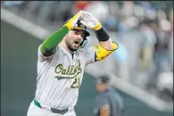  ?? Tony Gutierrez The Associated Press ?? Oakland catcher Shea Langeliers celebrates one of his three home runs against the Texas Rangers on Tuesday.