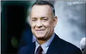  ?? PHOTO BY RICH FURY/INVISION/AP ?? In this 2016file photo, Tom Hanks arrives at the premiere of “Sully” in Los Angeles. Hanks will be the recipient of the Cecil B. DeMille Award at January’s Golden Globes Awards. he portrayed a 13-yearold boy whose body turned into a 35-year-old man overnight after making a wish.
The actor won a couple Globes for “Philadelph­ia” and “Forrest Gump,” two films that earned him Academy Awards. He was also lauded for his directing work in HBO’s 2001 miniseries “Band of Brothers,” which won an Emmy.
In 2014, Hanks received an award at the