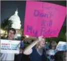  ?? ASSOCIATED PRESS FILE ?? FILE - In this July 27 photo, demonstrat­ors rally outside of the Capitol on Capitol Hill in Washington.