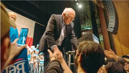  ?? —AFP ?? Democratic presidenti­al candidate Sen. Bernie Sanders greets supporters after his speech at a campaign rally in Texas.