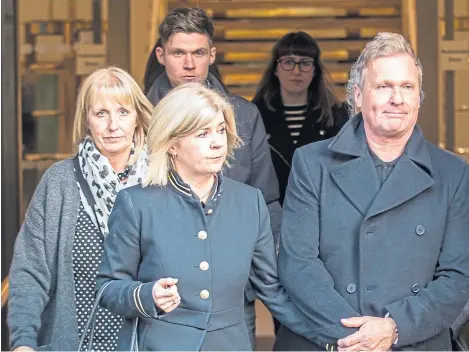  ?? Picture: Wullie Marr. ?? Linda McDonald and her husband leave court, with a group of family and friends following.