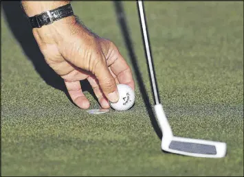  ?? CURTIS COMPTON / CCOMPTON@AJC.COM ?? “I know a number of guys on Tour that are loose with how they mark the ball.” says Phil Mickelson, who is marking his ball Tuesday.