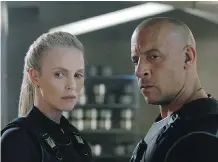  ??  ?? Dwayne “The Rock” Johnson, left, Charlize Theron and Vin Diesel are among the stars in The Fate of the Furious.