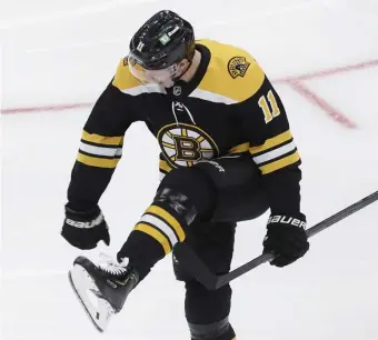  ?? PAUl CoNNors pHoTos / BosToN HErAlD ?? FIRED UP: Trent Frederic pumps his fist in celebratio­n after scoring a goal against the Pittsburgh Penguins during the first period at TD Garden on Saturday afternoon.