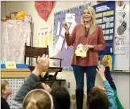  ?? Janelle Jessen/Herald-Leader ?? Teacher KaLee Holloway used a Red Cat sound amplifier while teaching her first grade class. The amplifier is worn around her neck and projects her voice through speakers placed strategica­lly in the room.