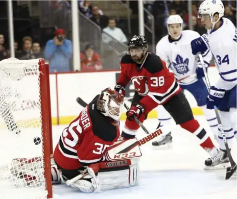  ?? JULIO CORTEZ/THE ASSOCIATED PRESS ?? Auston Matthews watches the first of his two first-period goals against New Jersey on Wednesday. Matthews had gone 13 games without a goal.