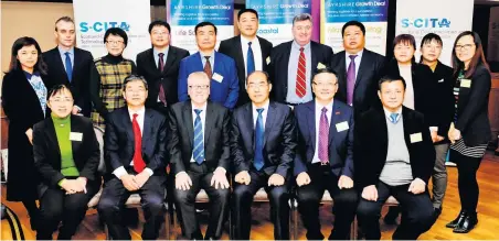  ?? ?? Building bridges Brian McGinley, deputy council leader, poses with the delegation from China at Council HQ in September 2018