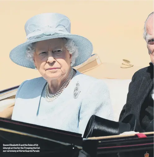  ??  ?? Queen Elizabeth II and the Duke of Edinburgh arrive for the Trooping the Colour ceremony at Horse Guards Parade