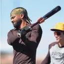  ?? LINDSEY WASSON/AP ?? Padres outfielder Fernando Tatis Jr. warms up during a spring training workouts on Tuesday in Peoria, Ariz.