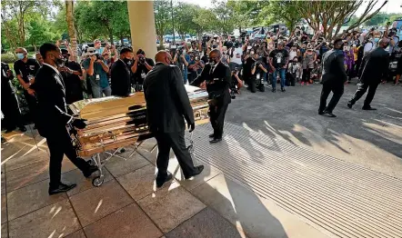  ?? AP ?? The casket of George Floyd is removed after a public visitation for Floyd at the Fountain of Praise church, yesterday in Houston.