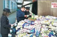  ?? WANG JIANMIN / FOR CHINA DAILY ?? Product quality inspectors destroy substandar­d imported goods earlier this month in Lianyungan­g, Jiangsu province.