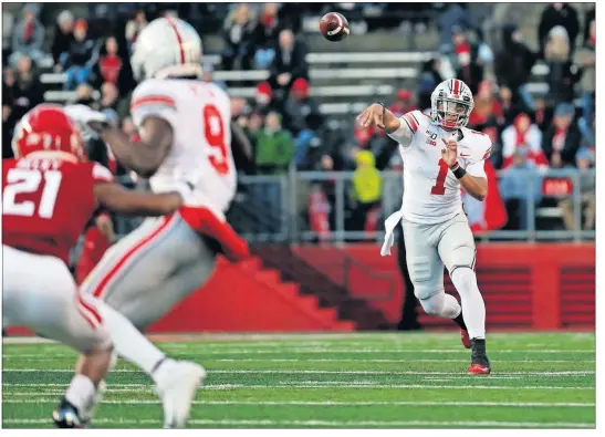  ?? [PHOTOS BY ADAM HUNGER/THE ASSOCIATED PRESS] ?? Ohio State quarterbac­k Justin Fields passes against Rutgers during last Saturday’s game in Piscataway, N.J.