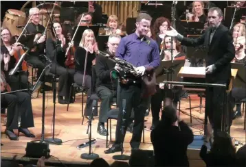  ??  ?? Uilleann piper Mark Redmond was given a prolonged standing ovation at the NCH on Friday night.