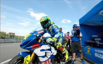  ?? Anthony Conroy/ Post- Gazette ?? Yoshimura Suzuki factory rider Toni Elias exits his pit box aboard his GSX- 1000R during a MotorAmeri­ca Superbike practice session at Pittsburgh Internatio­nal Race Complex in 2018.