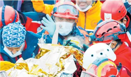  ?? Photo / AP ?? Three-year-old Elif Perincek is rescued from earthquake rubble in Izmir, Turkey.