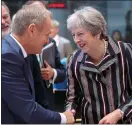  ??  ?? Handshake: Theresa May in Brussels with European Council president Donald Tusk