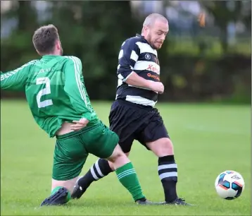  ??  ?? Andrew Duffy, Quay Celtic takes the ball past Jack Fitzpatric­k, Duleek.