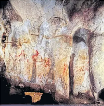  ??  ?? Neandertha­l paintings in a cave in Pasiega, Spain.