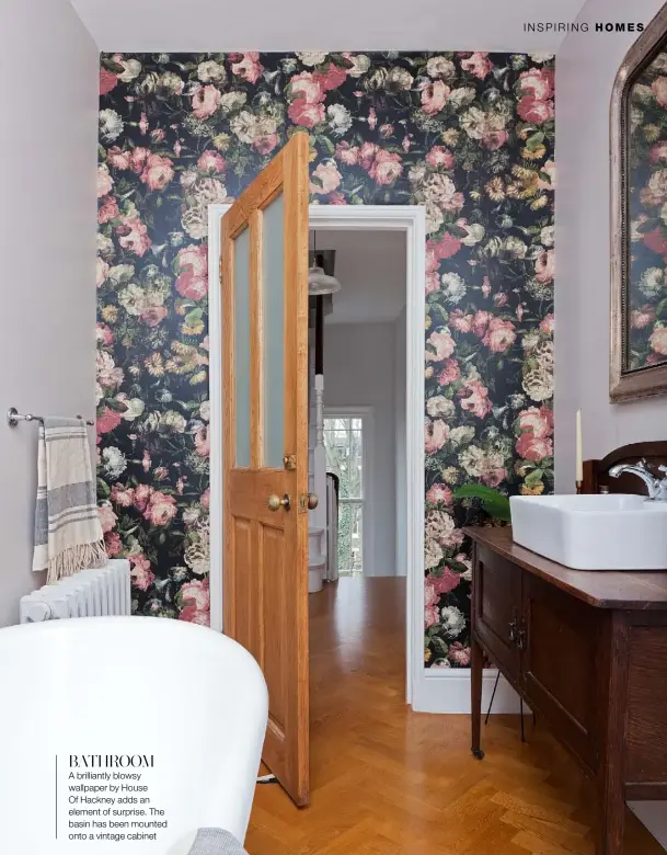  ??  ?? BATHROOM
A brilliantl­y blowsy wallpaper by House Of Hackney adds an element of surprise. The basin has been mounted onto a vintage cabinet