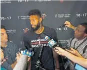  ?? JOE CAVARETTA/STAFF PHOTOGRAPH­ER ?? James Johnson speaks to the media during exit interviews on Monday at the AmericanAi­rlines Arena in Miami.