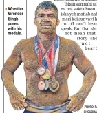  ?? PHOTO: RAVI CHOUDHARY/HT ?? Wrestler Virender Singh poses with his medals.