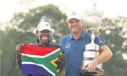  ?? Picture: Gallo Images ?? PERFECT PARTNERSHI­P. Graeme Storm and caddie Thama Jeffrey Nkonyane after Storm beat Rory McIlroy in a play-off to win the SA Open at Glendower on Sunday.