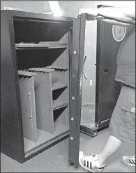  ?? Arkansas Democrat-Gazette/BRYAN HENDRICKS ?? Eli Knippenber­g flexes the door of a popular safe that is built with 14-gauge steel.