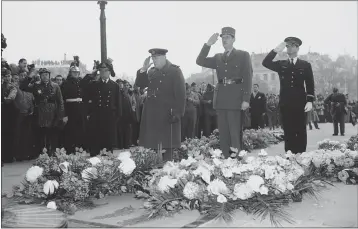  ?? PHOTOS BY THE ASSOCIATED PRESS ?? Britain’s Prime Minister Winston Churchill, left, and Gen. Charles De Gaulle, center, salute at France’s Unknown Warrior at the Arc De Triomphe in Paris. Though allies in World War II, De Gaulle twice vetoed Britain’s applicatio­n in the 1960s to join what was then known as the European Economic Community.