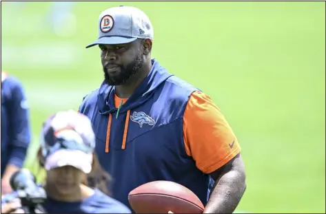  ?? AARON ONTIVEROZ — THE DENVER POST ?? Broncos defensive line coach Marcus Dixon works during minicamp at the team’s training facility earlier this month.