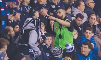  ??  ?? YOU’RE OUT: Carlton fans being escorted from Marvel Stadium by security.