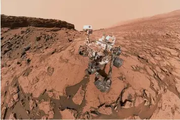 ?? Foto: Nasa, dpa ?? Dieses Foto der Nasa zeigt den Weltraum Roboter Curiosity bei der Arbeit auf dem Planeten Mars. Die Aufnahme entstand am so genannten Mount Sharp, einem Berg, den der Roboter untersucht.