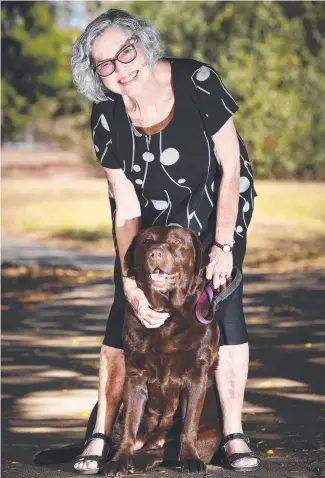  ??  ?? Volunteer Wendy Gardam with Story Dog Gabby. Picture: Shae Beplate