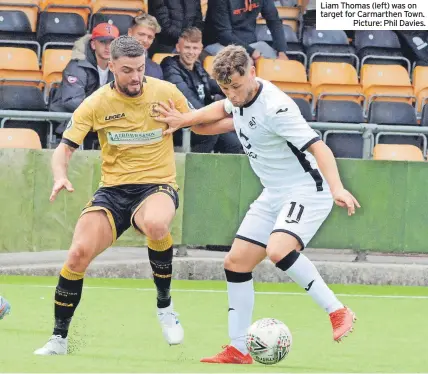  ?? ?? Liam Thomas (left) was on target for Carmarthen Town.
Picture: Phil Davies.