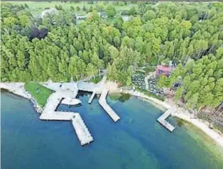  ?? COURTESY OF NAI PFEFFERLE ?? Little Sister Resort in Sister Bay was listed for sale Thursday, along with Fred & Fuzzy’s Waterfront Bar & Grill.