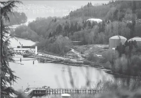  ?? CARMINE MARINELLI ?? The Kinder Morgan facility is seen in the Burrard Inlet in Burnaby, B.C. After a decade of trying to appease environmen­tal groups, the gloves are coming off in the battle over the controvers­ial Trans Mountain pipeline extension, Claudia Cattaneo writes.