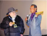  ?? COURTESY OF LINDA CARFAGNO ?? George R.R. Martin presenting Wes Studi his award at the 2017 Santa Fe Independen­t Film Festival.