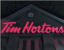  ?? CP PHOTO ?? A Tim Hortons restaurant sign is shown in Newcastle, Ont. on Sunday Feb. 11, 2018. Tim Hortons is moving its headquarte­rs from Oakville, Ont. to downtown Toronto.