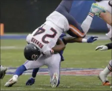  ?? SETH WENIG - THE ASSOCIATED PRESS ?? Chicago Bears running back Jordan Howard (24) is upended by New York Giants strong safety Landon Collins during the first half of an NFL football game, Sunday, Dec. 2, 2018, in East Rutherford, N.J.