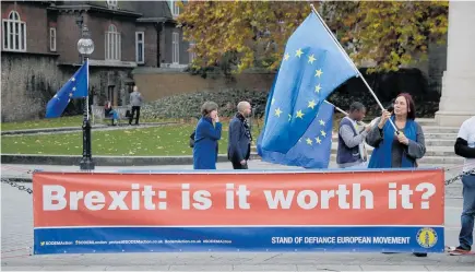  ?? Photo / AP ?? Ant-Brexit campaigner­s let politician­s know how they felt when they protested outside the Houses of Parliament in London yesterday.