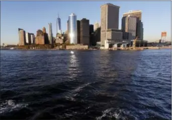  ?? SETH WENIG — THE ASSOCIATED PRESS ?? Water from New York Harbor surrounds the southern tip of New York’s Manhattan borough on Tuesday seen from aboard a Staten Island Ferry. Superstorm Sandy roared ashore five years ago, Monday devastatin­g the coastlines of New Jersey, New York and parts...