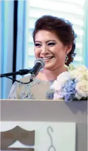  ??  ?? FROM TOP The decoration­s were simply yet elegantly done; the bride’s sister Tasha giving a speech; Datuk Wan Fusil lovingly hugging his daughter on her wedding day; the wonderful ambience was enjoyed by all