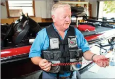  ?? RUSTY HUBBARD/THREE RIVERS EDITION ?? Greg Deen of Jacksonvil­le talks about the use of a lanyard that activates a motor kill switch if a boater is thrown from the craft.