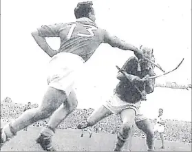  ??  ?? Richie Browne (No 13) in action with Cork legend Christy Ring in the Munster senior hurling championsh­ip, Cork v Waterford, in Thurles in 1961.