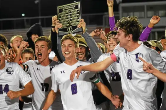  ?? AUSTIN HERTZOG — DIGITAL FIRST MEDIA ?? Phoenixvil­le celebrates after winning the PAC boys soccer title on Oct. 19. Below, Phoenixvil­le’s Kyle Tucker (9) and Tyler Siefer (6) lead the celebratio­n.